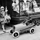 “A Dog Goes Shopping,” circa 1932: Henry Sandoni leaving a West End toy shop, laden down with Christmas presents, while his dog waits patiently in the car. (Photo: Hulton Archive/Getty Images)